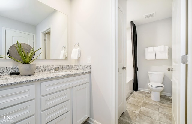 bathroom with toilet and vanity