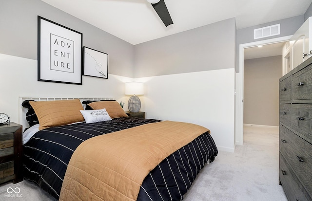 bedroom featuring ceiling fan and light carpet