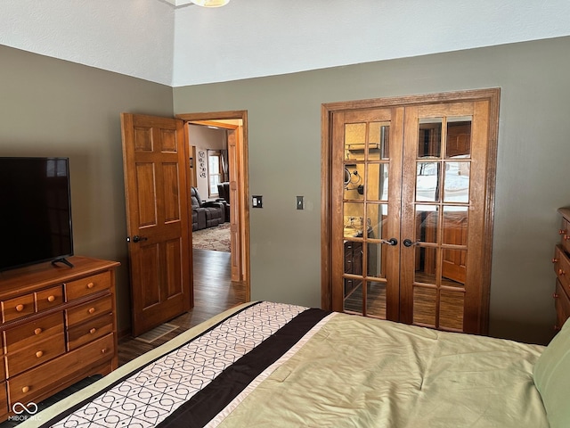 bedroom with dark hardwood / wood-style flooring