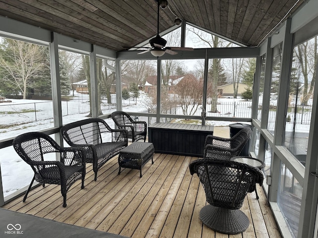 sunroom with ceiling fan, wood ceiling, and vaulted ceiling