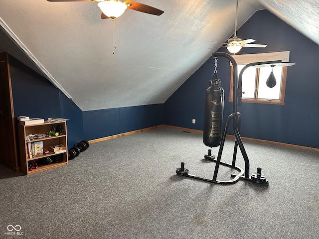 exercise area featuring ceiling fan, a textured ceiling, lofted ceiling, and carpet flooring