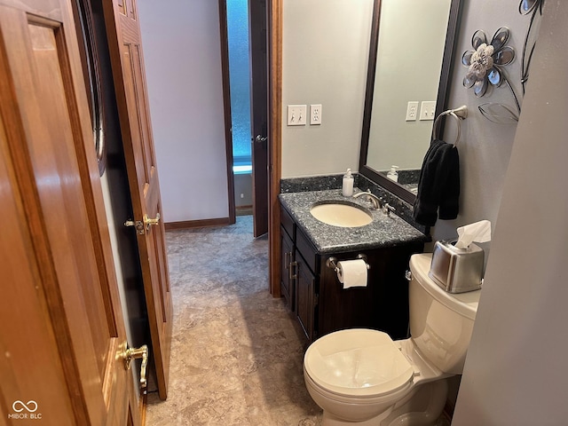 bathroom with toilet and vanity