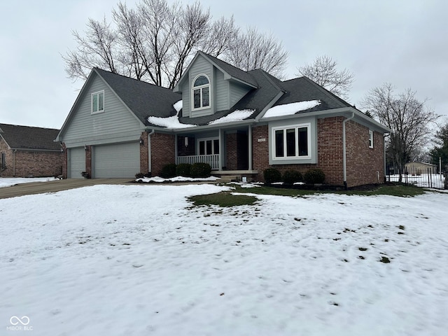 view of front of home with a garage and a porch