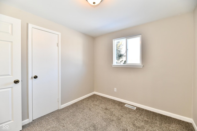 spare room featuring carpet flooring