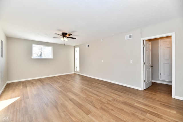 spare room featuring ceiling fan, a textured ceiling, and light hardwood / wood-style flooring