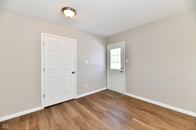 unfurnished room featuring wood-type flooring