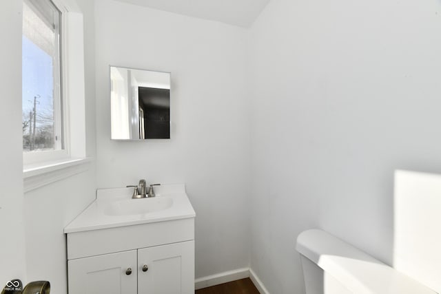 bathroom featuring toilet and vanity