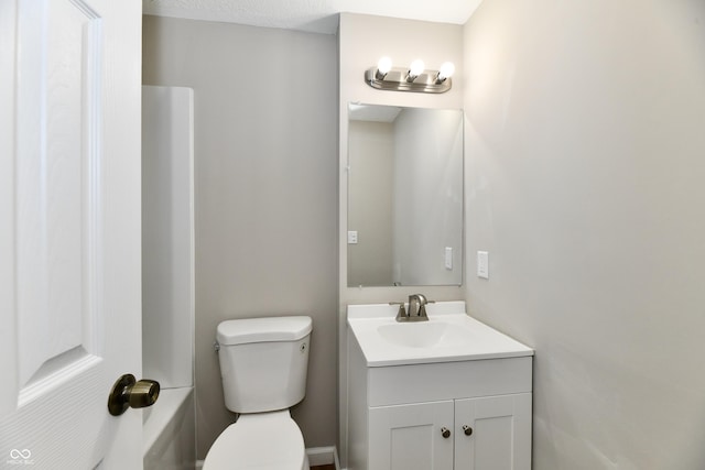 bathroom with toilet and vanity