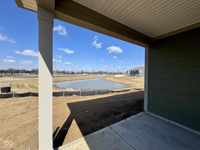 view of yard with central AC and a water view