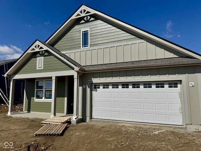 view of front facade featuring a garage and board and batten siding