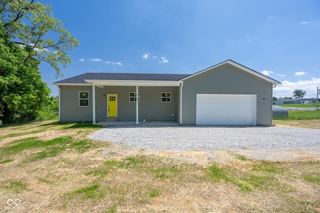 303 Doe Creek Dr, Cloverdale, IN 46120 - ranch-style house featuring an attached garage and driveway