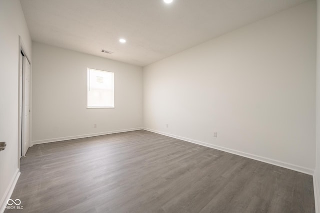 303 Doe Creek Dr, Cloverdale, IN 46120 - unfurnished bedroom with dark wood finished floors, baseboards, recessed lighting, and a closet