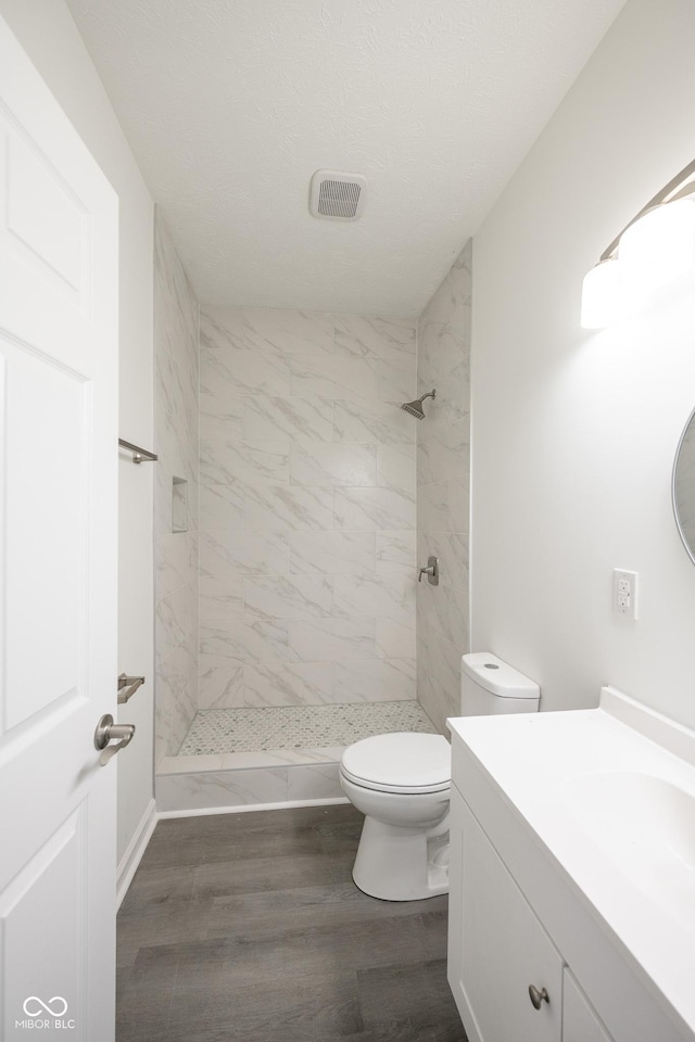 303 Doe Creek Dr, Cloverdale, IN 46120 - full bathroom featuring toilet, a stall shower, wood finished floors, and vanity