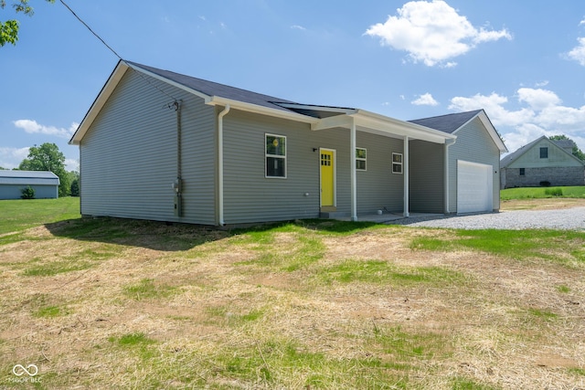 303 Doe Creek Dr, Cloverdale, IN 46120 - view of front of property featuring a garage and a front lawn