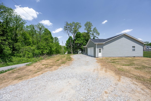 303 Doe Creek Dr, Cloverdale, IN 46120 - view of side of property featuring driveway and a garage