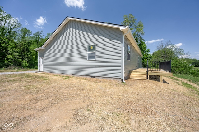 303 Doe Creek Dr, Cloverdale, IN 46120 - view of side of home featuring a wooden deck and crawl space