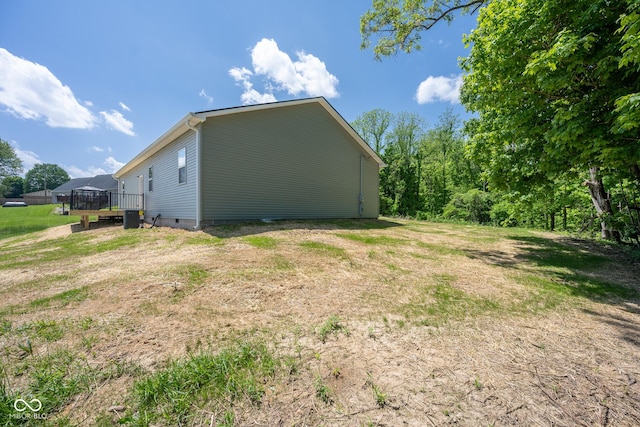 303 Doe Creek Dr, Cloverdale, IN 46120 - view of property exterior with crawl space and a wooden deck