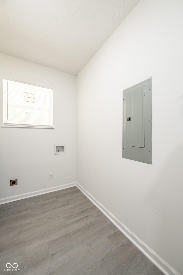 303 Doe Creek Dr, Cloverdale, IN 46120 - washroom featuring electric panel, hookup for a washing machine, wood finished floors, and baseboards
