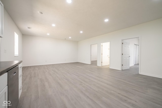 303 Doe Creek Dr, Cloverdale, IN 46120 - unfurnished living room with recessed lighting, light wood-style flooring, and baseboards