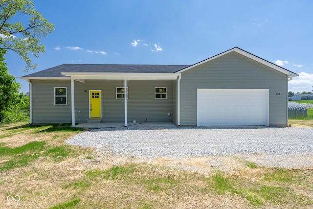303 Doe Creek Dr, Cloverdale, IN 46120 - ranch-style house with a garage and gravel driveway