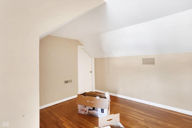 2934 S Irwin St, Indianapolis, IN 46203 - bonus room featuring wood finished floors, vaulted ceiling, and baseboards