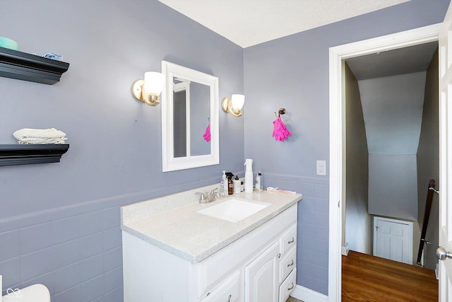 2934 S Irwin St, Indianapolis, IN 46203 - bathroom with tile walls, vanity, and a wainscoted wall