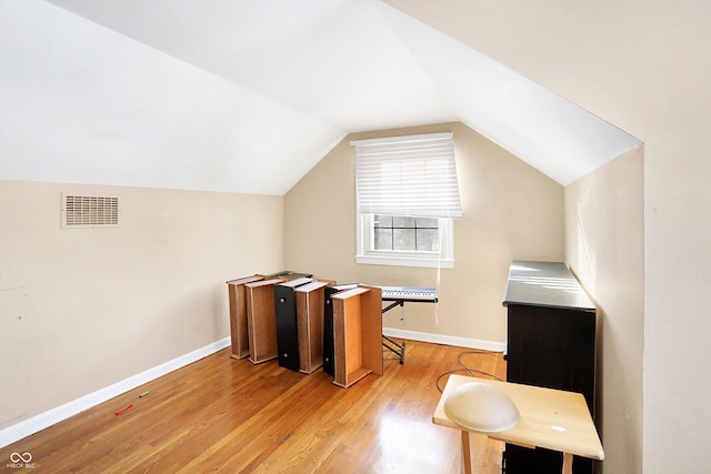 2934 S Irwin St, Indianapolis, IN 46203 - bonus room featuring light wood-style floors, vaulted ceiling, and baseboards