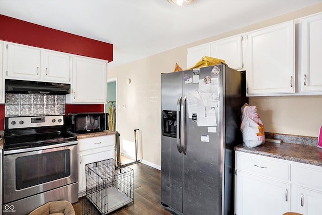 2934 S Irwin St, Indianapolis, IN 46203 - kitchen featuring appliances with stainless steel finishes, under cabinet range hood, white cabinetry, and dark wood finished floors