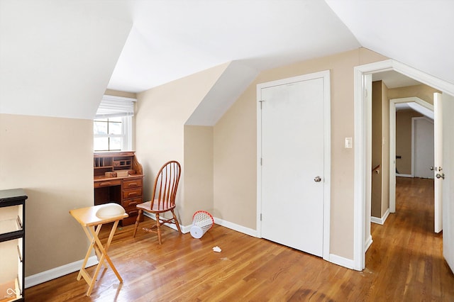 2934 S Irwin St, Indianapolis, IN 46203 - sitting room featuring lofted ceiling, wood finished floors, and baseboards
