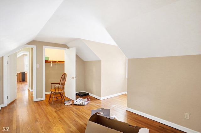 2934 S Irwin St, Indianapolis, IN 46203 - bonus room featuring light wood-type flooring, vaulted ceiling, and baseboards