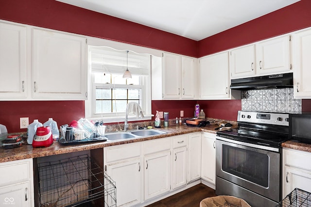 2934 S Irwin St, Indianapolis, IN 46203 - kitchen with stainless steel electric range oven, a sink, under cabinet range hood, and white cabinets