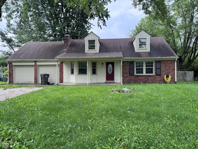 2934 S Irwin St, Indianapolis, IN 46203 - new england style home featuring a chimney, a garage, a front yard, brick siding, and gravel driveway