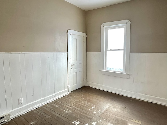 empty room featuring dark hardwood / wood-style floors