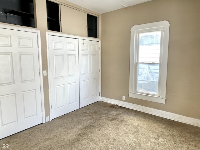 unfurnished bedroom with carpet flooring