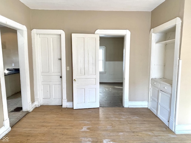 unfurnished bedroom with light hardwood / wood-style floors