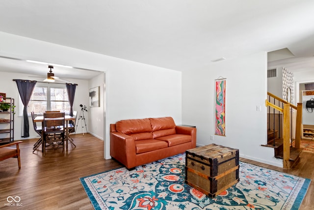 living room with ceiling fan and hardwood / wood-style floors