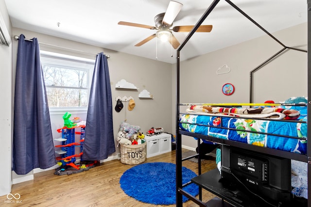 rec room with hardwood / wood-style flooring and ceiling fan