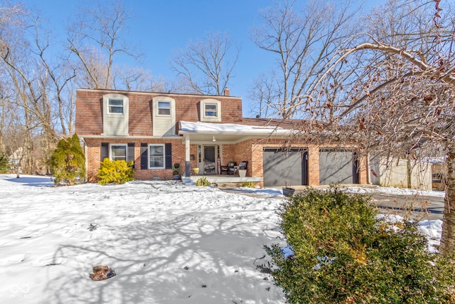 view of front of home with a porch and a garage