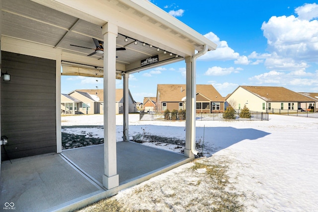 snow covered patio with ceiling fan