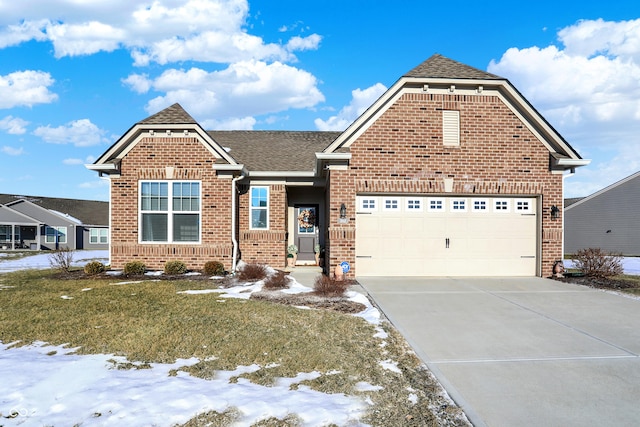 view of front facade with a yard and a garage