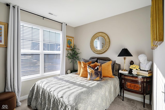 bedroom featuring light colored carpet