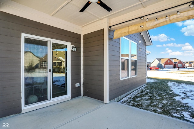 exterior space with ceiling fan and a patio area