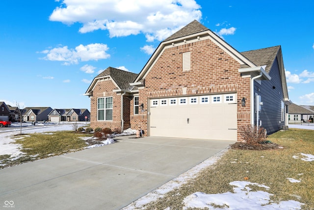 view of front property featuring a garage and a front yard