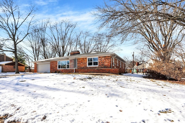 single story home with a garage