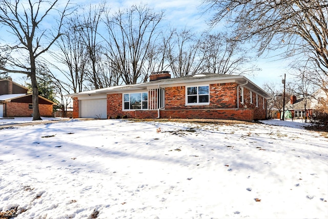 single story home featuring a garage