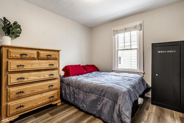 bedroom featuring dark hardwood / wood-style flooring