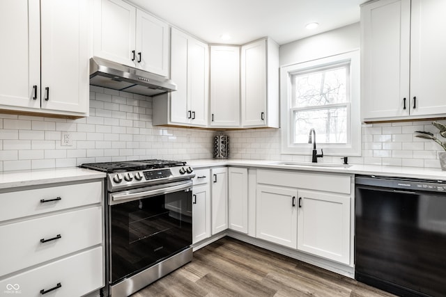 kitchen featuring white cabinets, black dishwasher, sink, and stainless steel gas range