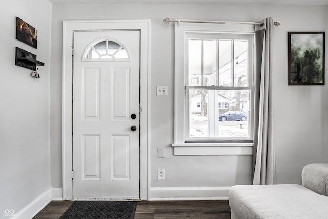 foyer with dark hardwood / wood-style floors