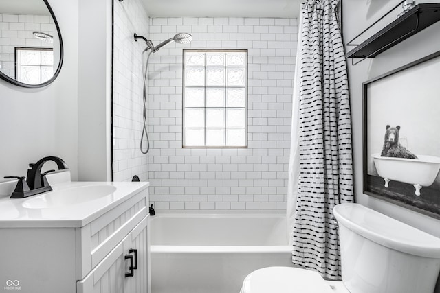 full bathroom with vanity, toilet, and shower / tub combo