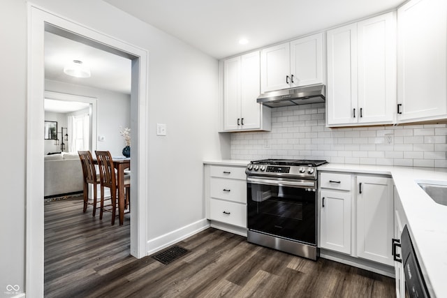 kitchen with white cabinetry, dishwashing machine, backsplash, dark hardwood / wood-style flooring, and gas range